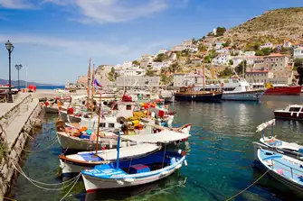 Surrounded by architectural and natural beauty the port of Hydra Town is a picturesque stop
