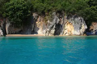 Explore rock formations and beautiful sea caves in the shores around Lefkas
