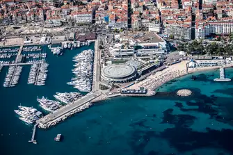 The Vieux Port is overlooked by historic Le Suquet on one side and the Palais des Festivals, home to the Cannes Film Festival, on the other