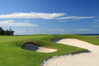 Absorb the scenic view while playing 18-holes over wave-battered cliffs and inland lakes