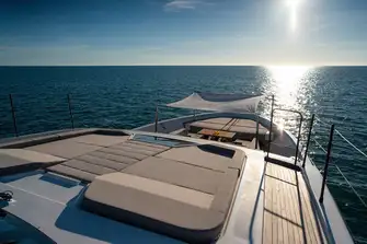 The large sunpad is accessible from the sun deck and a walkway on the main deck's starboard side leads to the foredeck lounge