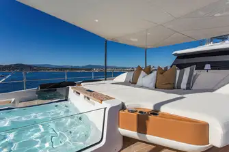 Forward of the foredeck lounge is a huge sunpad and a glass jacuzzi
