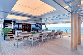 Open-air dining on the bridge deck aft