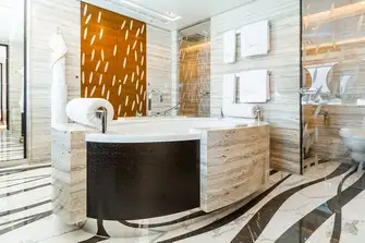 The owner's en suite has a feature bathtub
