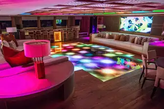 Roll up the rug, slide back the screen and the panoramic lounge becomes a nightclub
