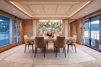 The dining room with its teak-decked balcony to starboard